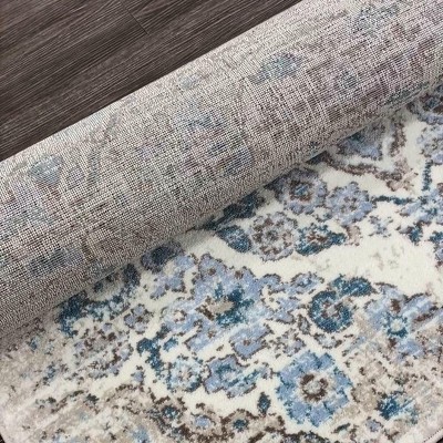 Cream and Blue 4' x 6' Synthetic Oriental Area Rug