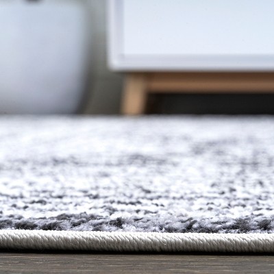 Ivory and Black Geometric Synthetic 8' x 10' Area Rug