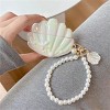 HTUTWOO Case For AirPods 2nd/1st Generation With Pearl Wrist Chain,Beautiful Creative Glitter 3D Headphone Protective Shell For Girls Women (Seashell) - 2 of 4