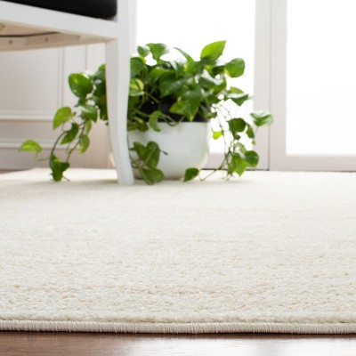 Ivory and Beige Synthetic Oriental 4' x 6' Area Rug