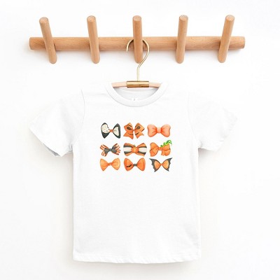 The Juniper Shop Coquette Girl Halloween Bow Chart Toddler Short Sleeve Tee