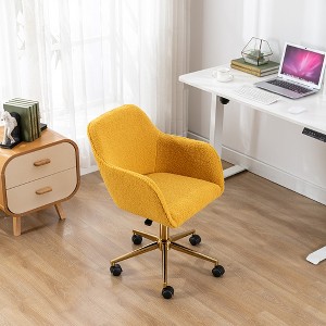This swivel office chair is height-adjustable, has wheels, gold-plated legs, and a chrome-plated base. - 1 of 4