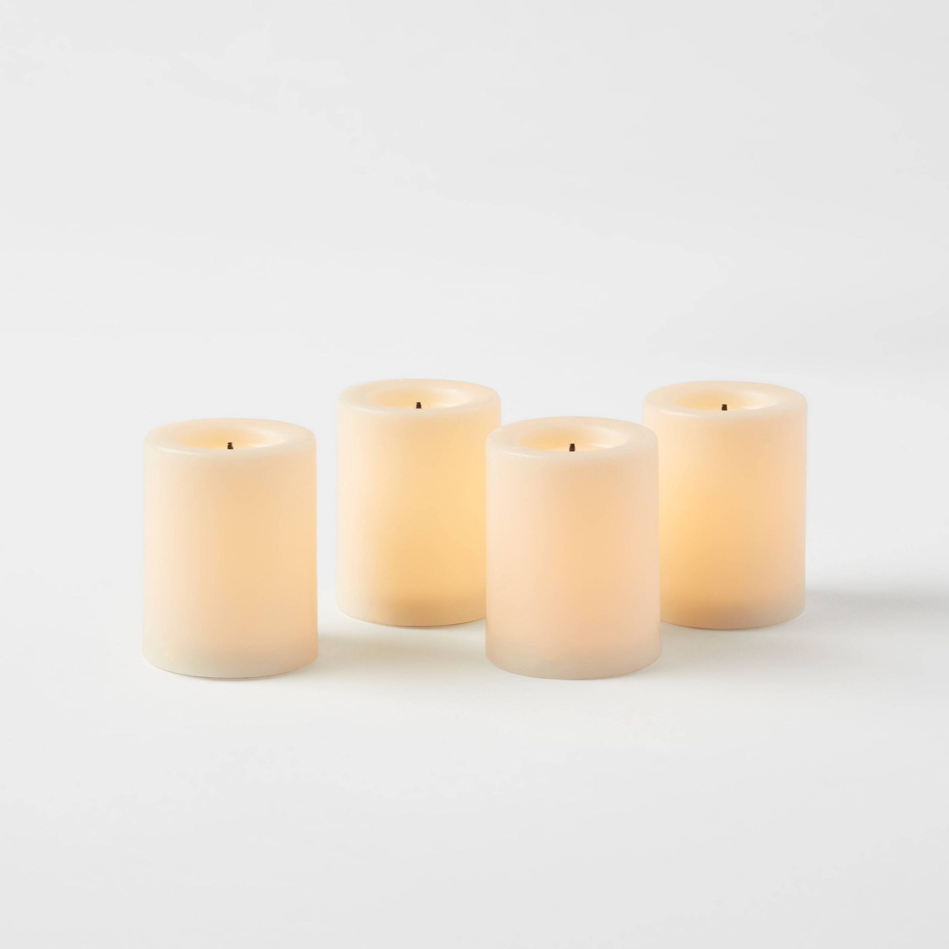 1.82" x 1.4" 4pk LED Votive Flameless Black Wick Candle Cream - Threshold™: Tea Lights, Safe Decor