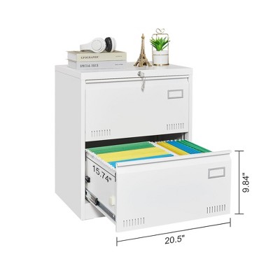 White locking two-drawer file cabinet with items on top