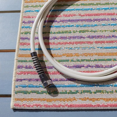 Ivory and Blue Synthetic 4' x 6' Easy-Care Outdoor Rug