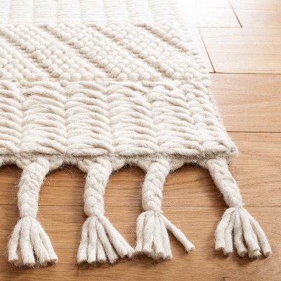 Ivory Handmade Wool Tufted 6' x 9' Area Rug