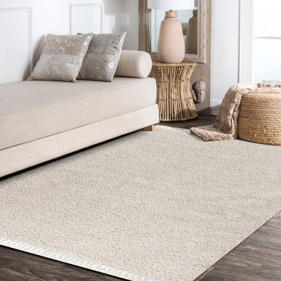 Cream 8' x 10' Reversible Shag Area Rug with Tassels