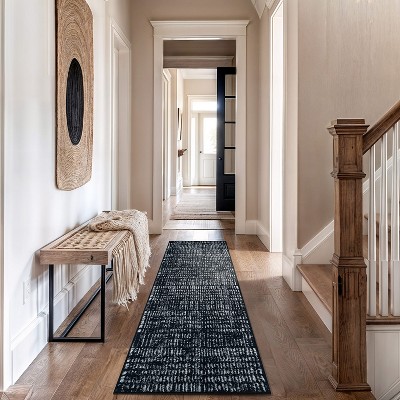 Black and Ivory Geometric Polypropylene Area Rug 2' x 7'