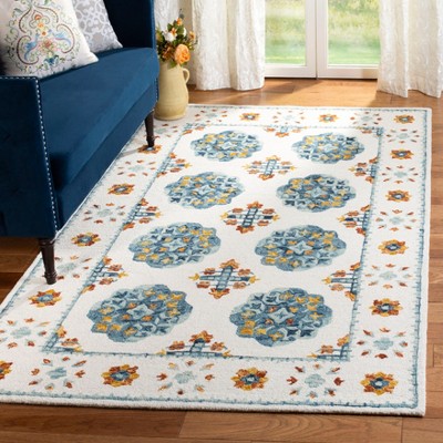 Handmade Blue Floral Wool 5' x 8' Tufted Area Rug