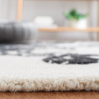 Ivory and Black Floral Tufted Wool 4' x 6' Rug
