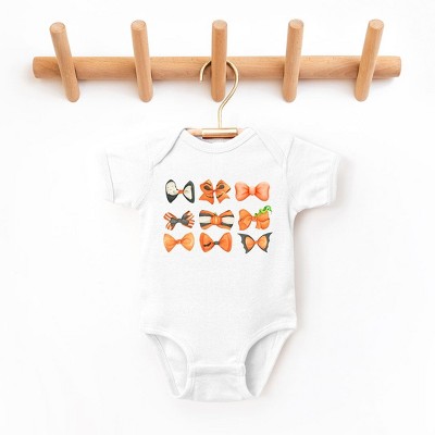The Juniper Shop Coquette Girl Halloween Bow Chart Baby Bodysuit