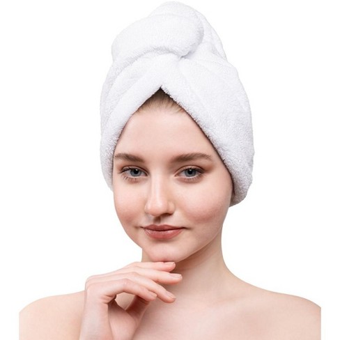 Hair towel with outlet button