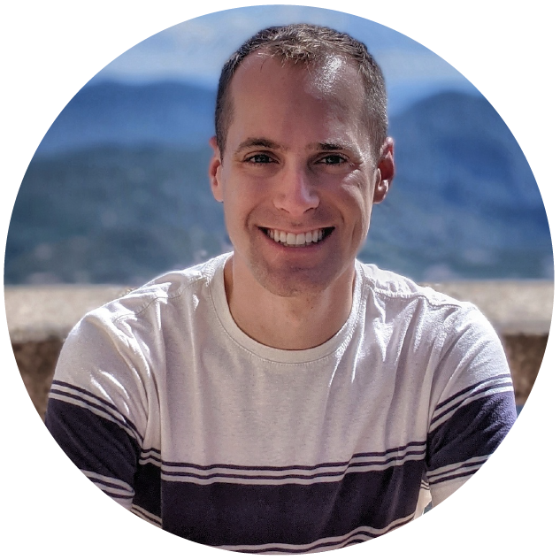 Bryan Herbst, Target Principal Android Engineer, smiling against a mountain scene in the background, wearing a white t-shirt with a navy blue stripe in the center