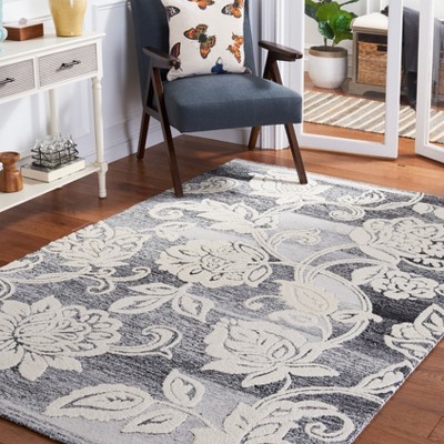 Handmade Black and Ivory Floral Wool Area Rug, 5' x 8'