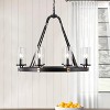 8-Light Black Wagon Wheel Chandelier with Clear Glass Shades for Dining Room or Foyer Lighting - 3 of 4