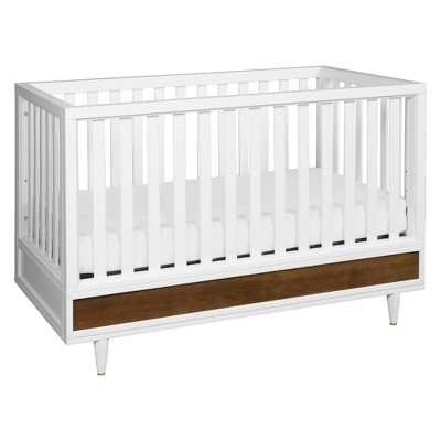 natural wood and white crib