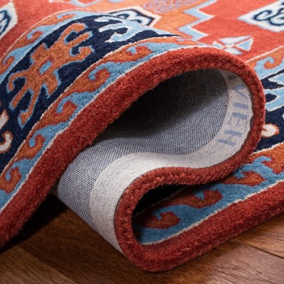 Elegant Heritage Red Wool 6' x 9' Hand-Tufted Rectangular Rug