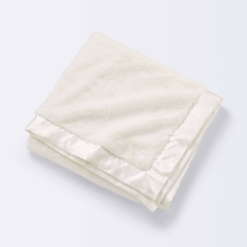 Fleece blanket best sale with silk trim