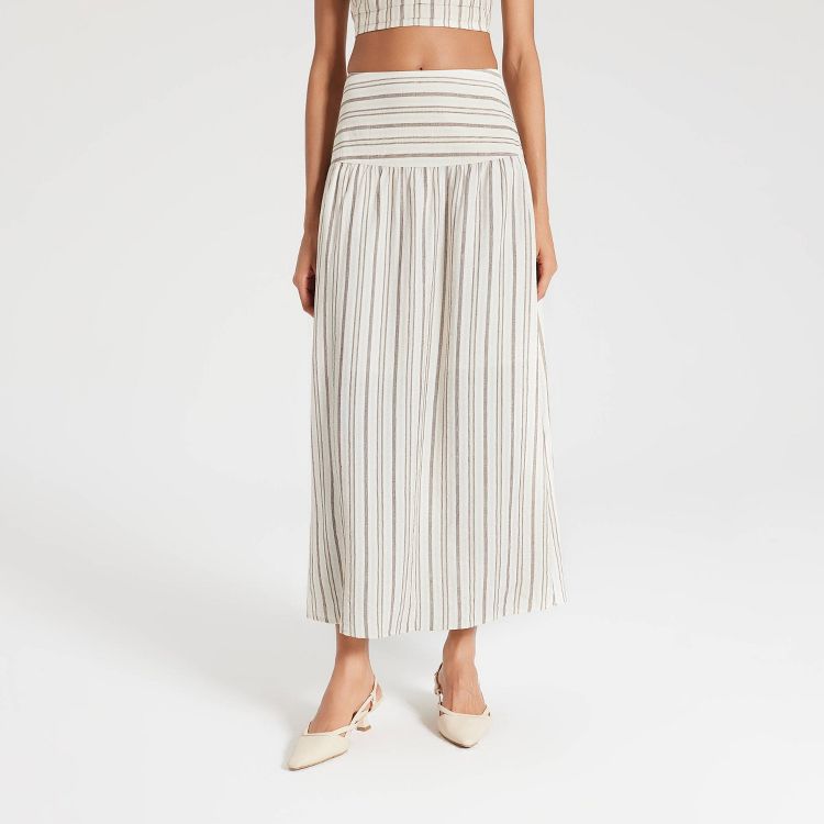 Ankle length skirt with vertical beige and white stripes.
