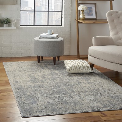 Ivory Abstract Power-Loomed Synthetic 5'3" x 7'3" Area Rug
