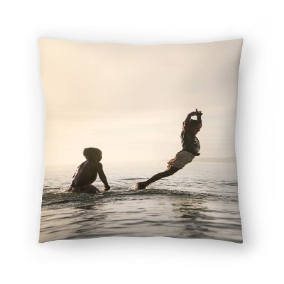 Kids Playing In Sunset Waves by Tanya Shumkina Throw Pillow - Americanflat