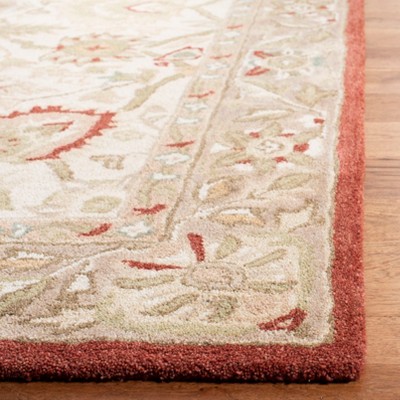 Handmade Beige and Rust Floral Wool Area Rug, 5' x 8'