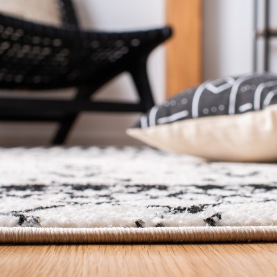 Ivory/Black Synthetic 6' x 9' Hand-Knotted Boho-Chic Area Rug