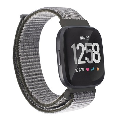 black fitbit versa with rose gold band