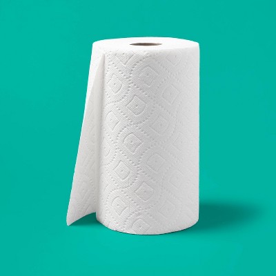 A roll of white colored paper towel with a textured pattern against a teal background.
