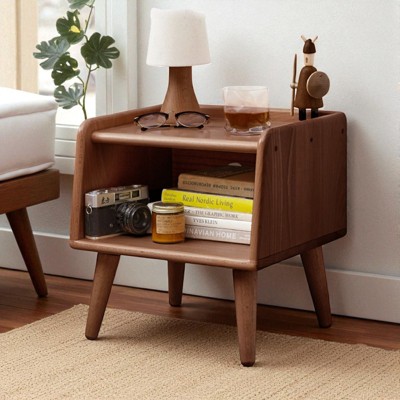 Bedside cabinet with top items and books