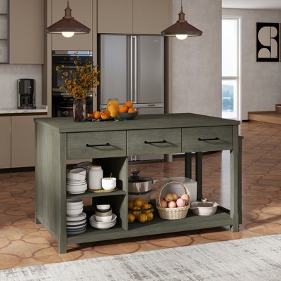 Kitchen island with drawers and storage in front of kitchen