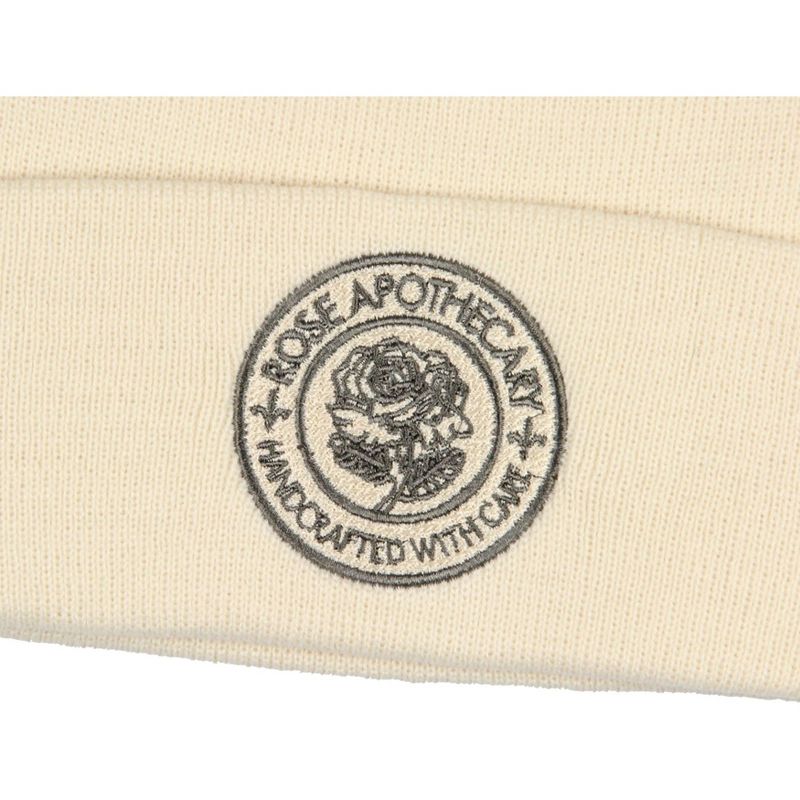 Schitt's Creek Rose Apothecary Handcrafted With Care Beanie Skull Cap Hat Off-White, 4 of 5