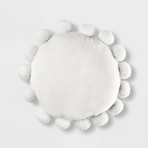 White pillow 2025 with pom poms