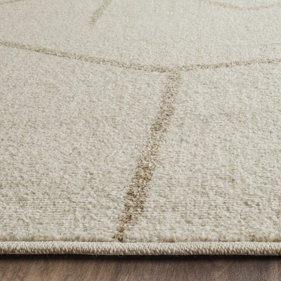 Ivory Geometric Easy-Care 8' x 10' Synthetic Area Rug