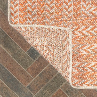 4' x 6' Ivory and Orange Geometric Synthetic Area Rug