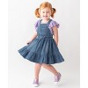 Girls Ruffled Dark Wash Denim Bow Skirt by RuffleButts main image 1