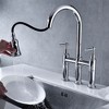 Kitchen Elegance Enhanced by a Polished Bridge Faucet with Pull-Down Spray - 2 of 4