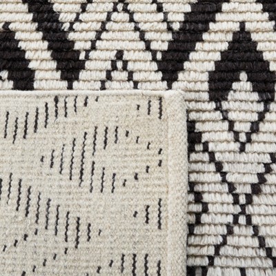 Hand-Knotted Black and Ivory Wool Area Rug, 5' x 8'