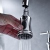 Kitchen Elegance Enhanced by a Polished Bridge Faucet with Pull-Down Spray - 4 of 4