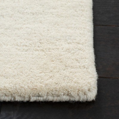 Ivory and Blue Hand-Tufted Wool Area Rug 5' x 8'