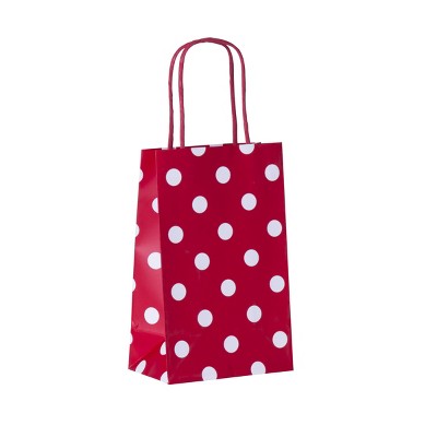 red polka dot luggage