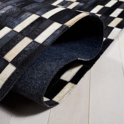 Black and Beige Handmade Geometric Cowhide Area Rug