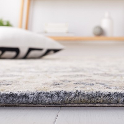 Beige and Multi 4' x 6' Hand-Tufted Wool Area Rug