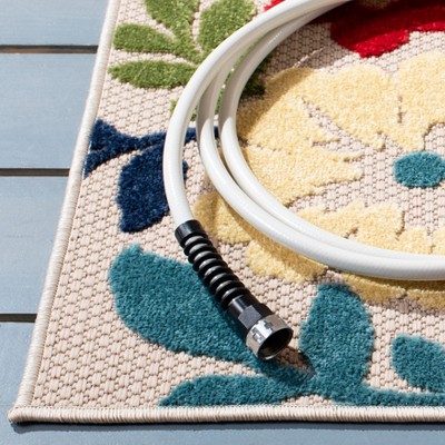 Ivory and Orange Floral Synthetic Indoor/Outdoor Area Rug