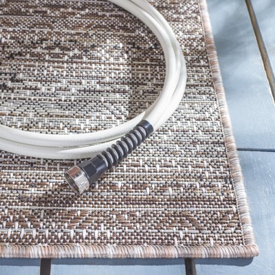 Ivory and Light Brown 8' x 10' Stain-Resistant Synthetic Area Rug