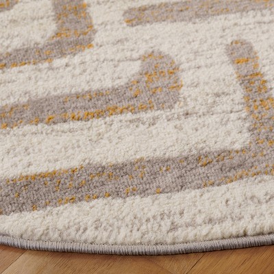 Ivory and Mauve Round Synthetic Abstract Area Rug