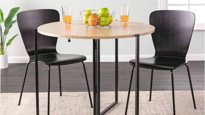 Valxina Round Folding Dining Table Natural/Black - Aiden Lane, 2 of 18, play video