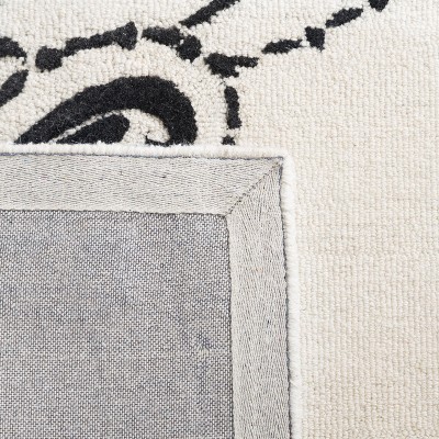 Ivory and Black Floral Tufted Wool 4' x 6' Rug