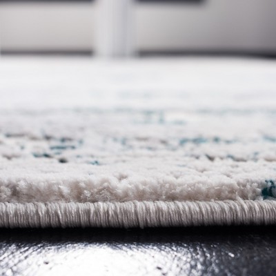 Cream and Turquoise Abstract Wool and Synthetic Area Rug, 3' x 5'