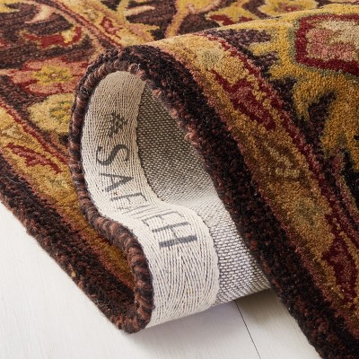 Antiquity Hand Tufted Wool Area Rug in Dark Plum and Gold